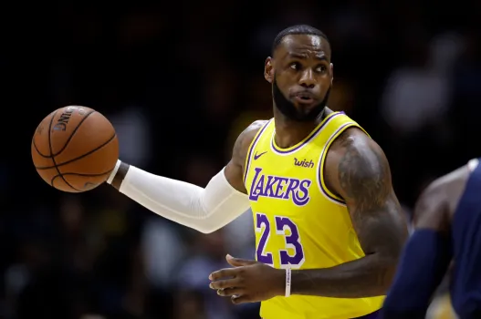 ChatGPT LeBron James, in his vibrant yellow Los Angeles Lakers jersey, showcases his "LeBron James Personal Brand" as he skillfully handles the basketball during a game.