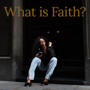 Woman sitting on stone steps outside a dark doorway, holding a phone, wearing glasses, a black blazer, light jeans, and black sandals, with the text “What Is Faith?” above her.