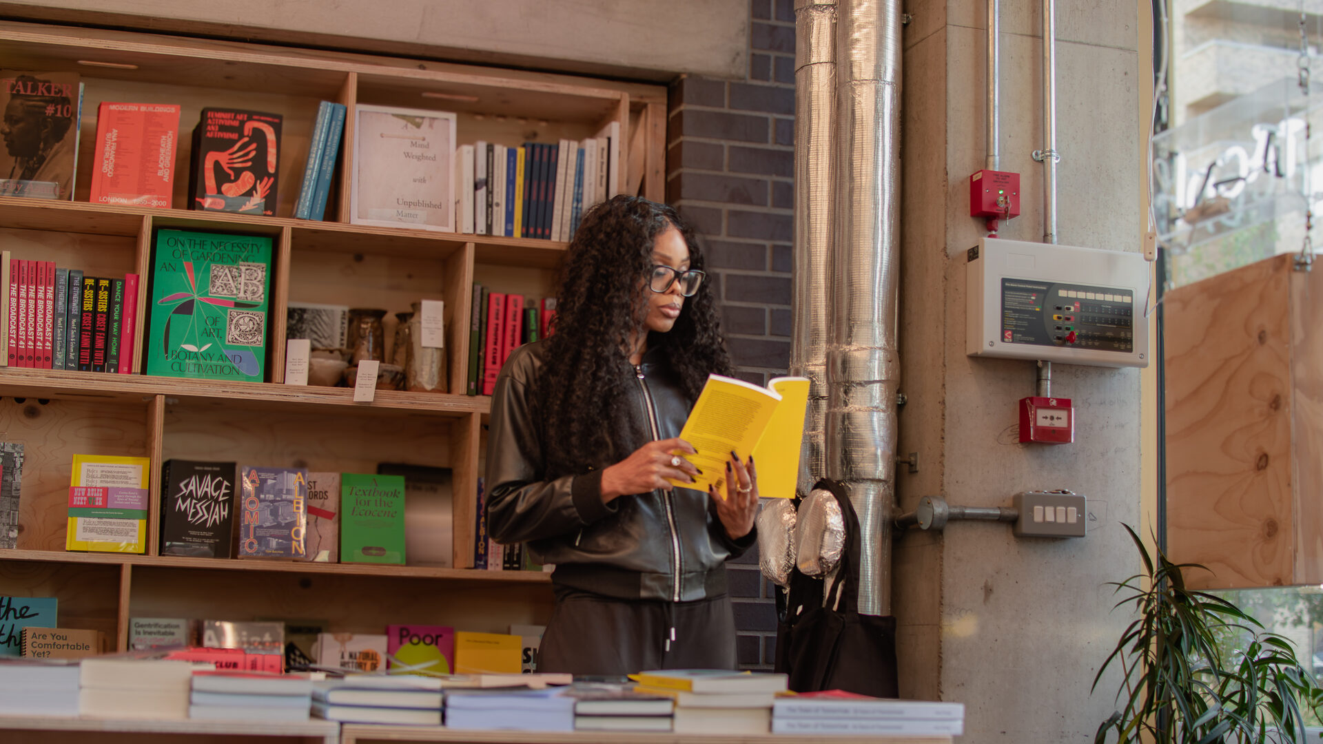 Decision Authority Cannot Be Installed by Policy 1 Bess Obarotimi reading in a bookshop while reflecting on decision authority and organisational governance