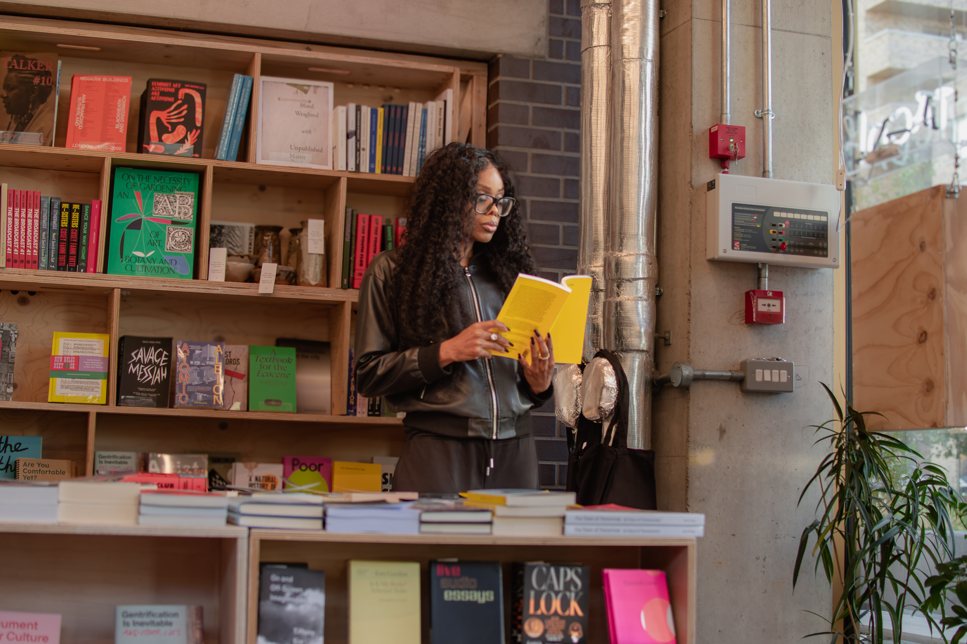 AI governance collaboration in organisations, professional reviewing documents in a bookstore setting